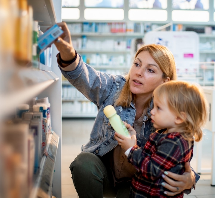 mom and son looking at medicine