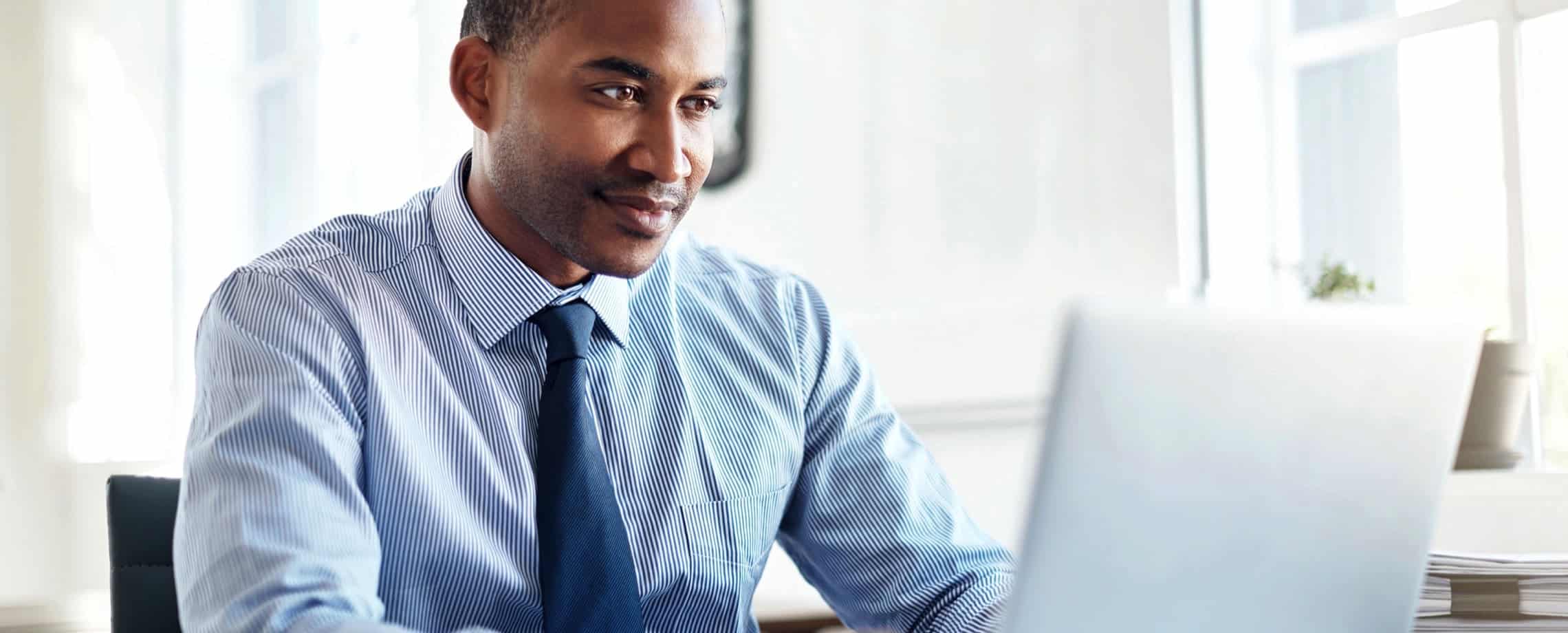 man looking at computer